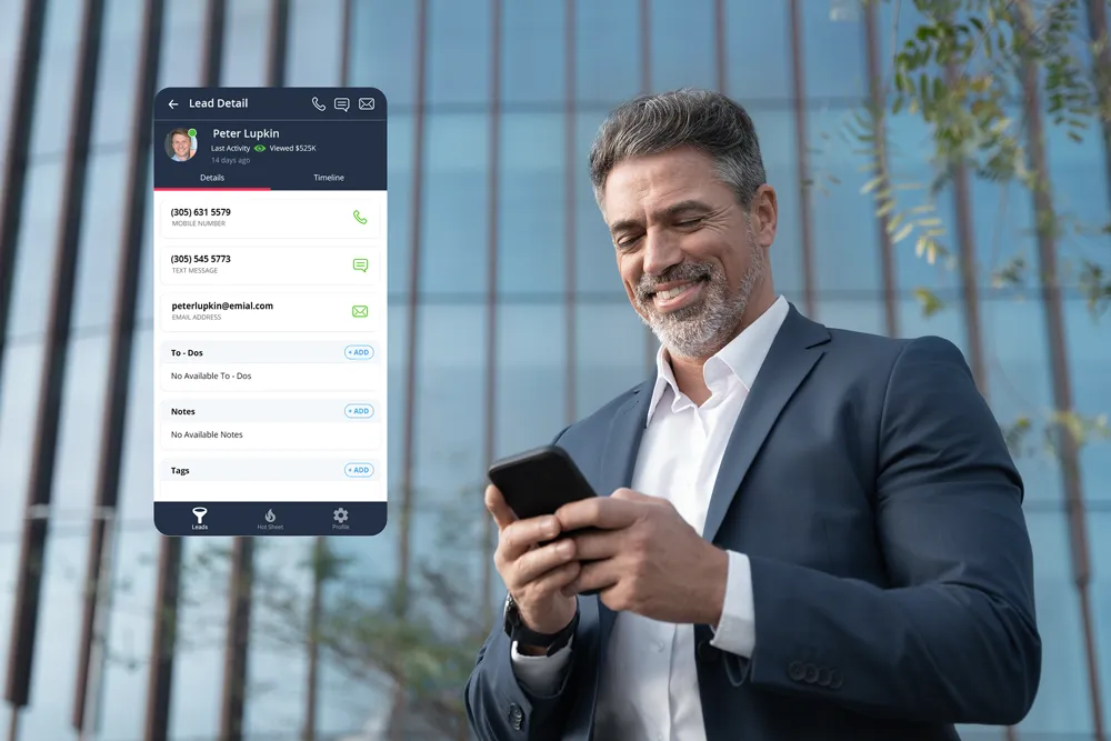 a real estate agent holding his phone watching a new lead alert in the crm generated from a real estate website