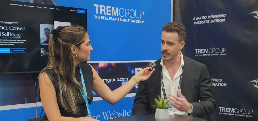 TREMGroup expert speaking with an agent at The Real Deal Miami Forum